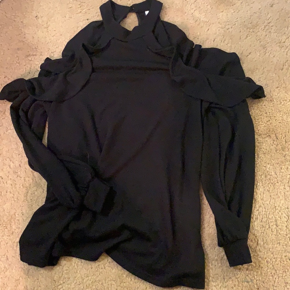 Off-the shoulder black shirt with ruffles